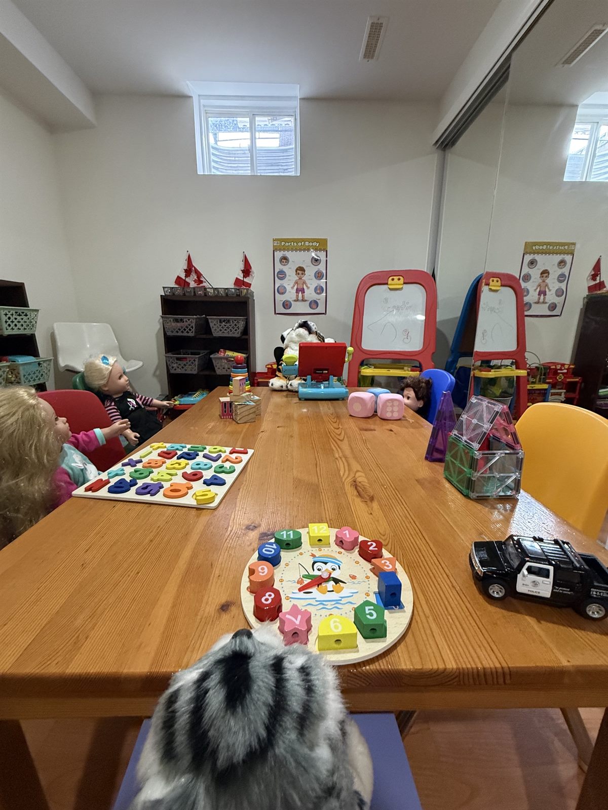 Child's hands working with a Montessori number puzzle