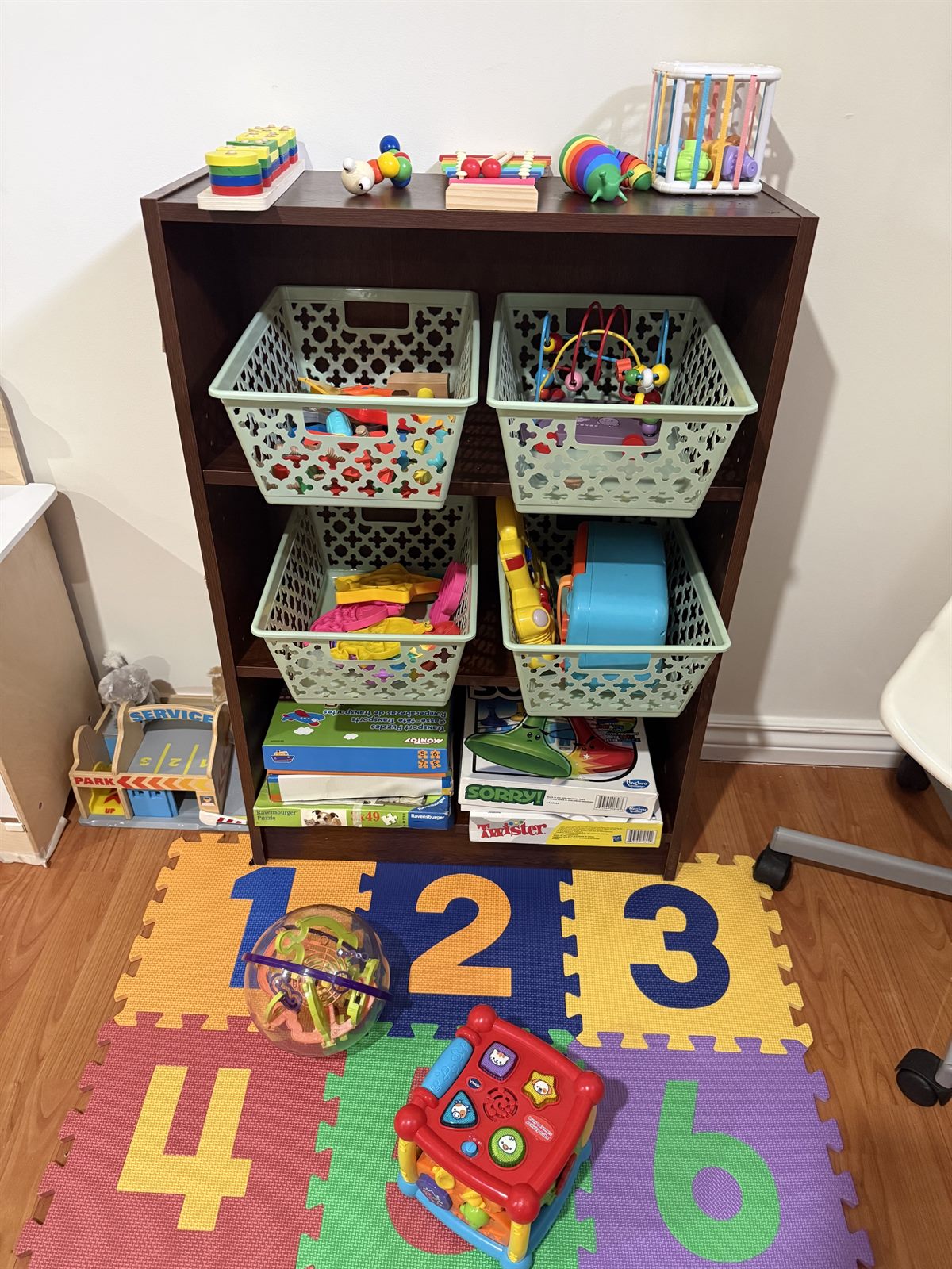Organized shelves of Montessori learning materials