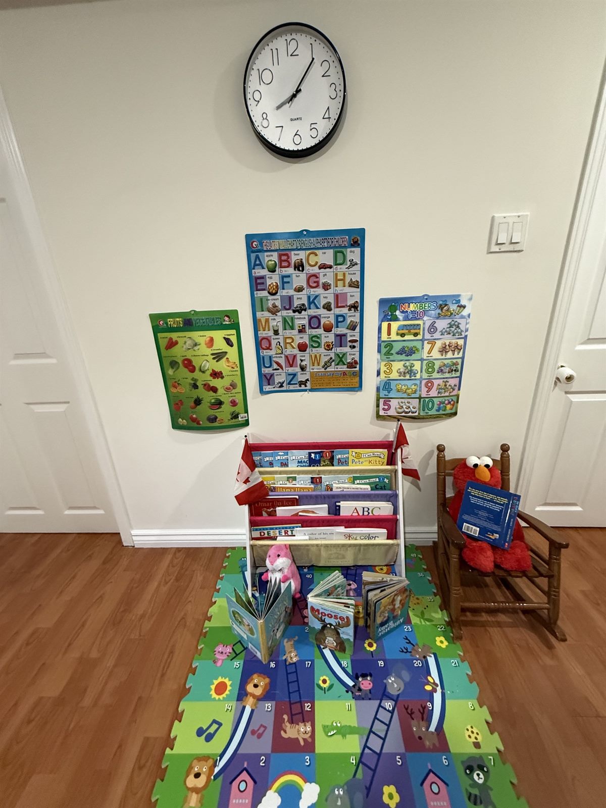 Reading corner with alphabet and number wall charts