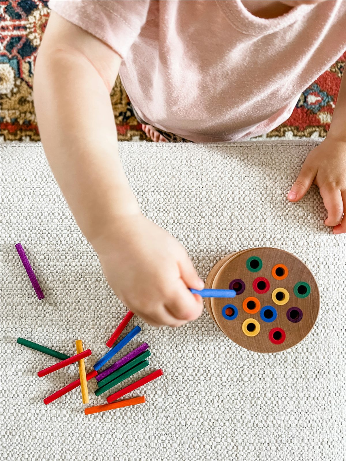 Toddler drawing with crayons at BrightSteps Montessori childcare